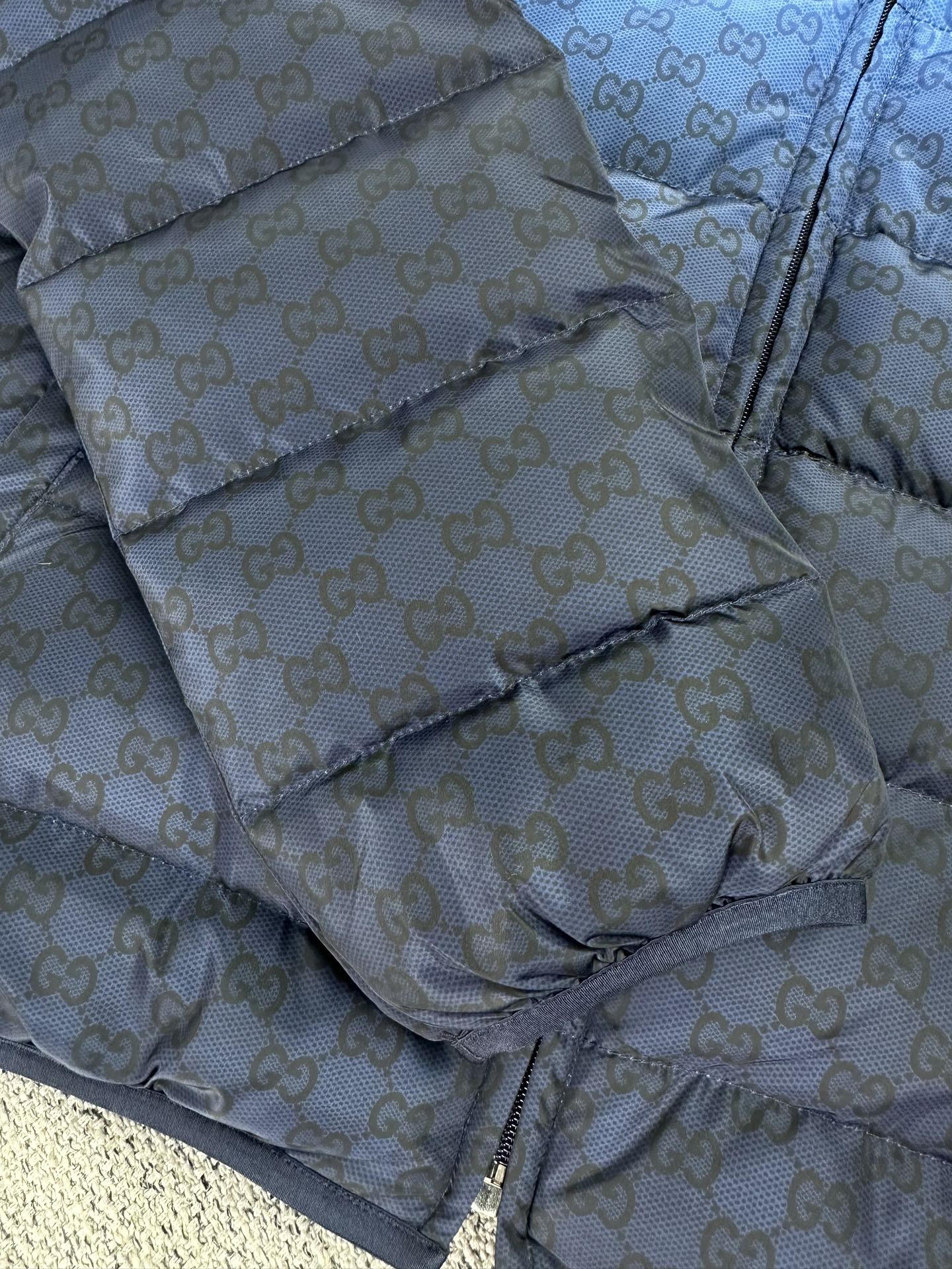 Gucci light-blue GG-pattern puffer jacket, diagonal quilted panel