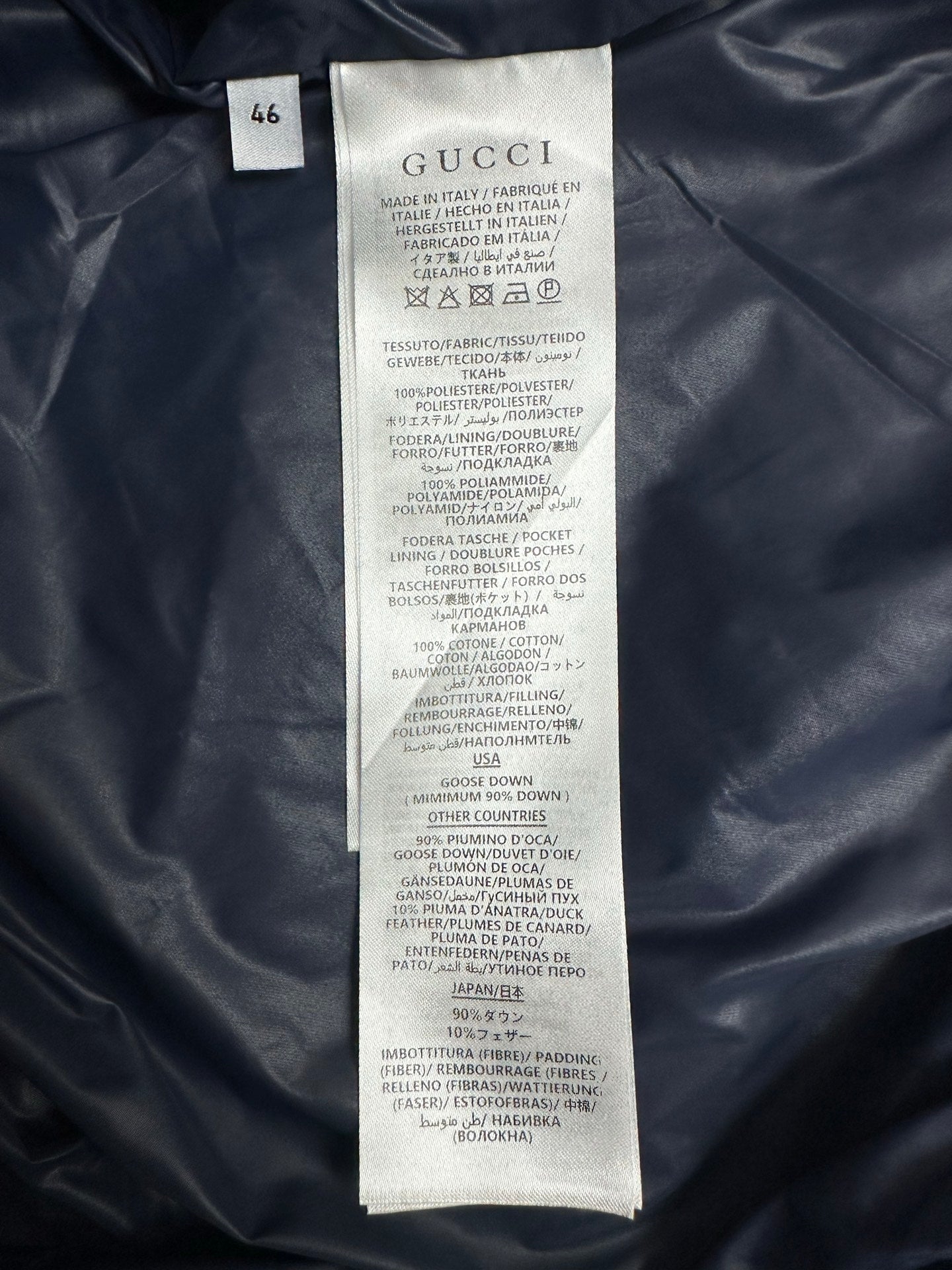 Gucci puffer jacket size and care label tag on inner seam