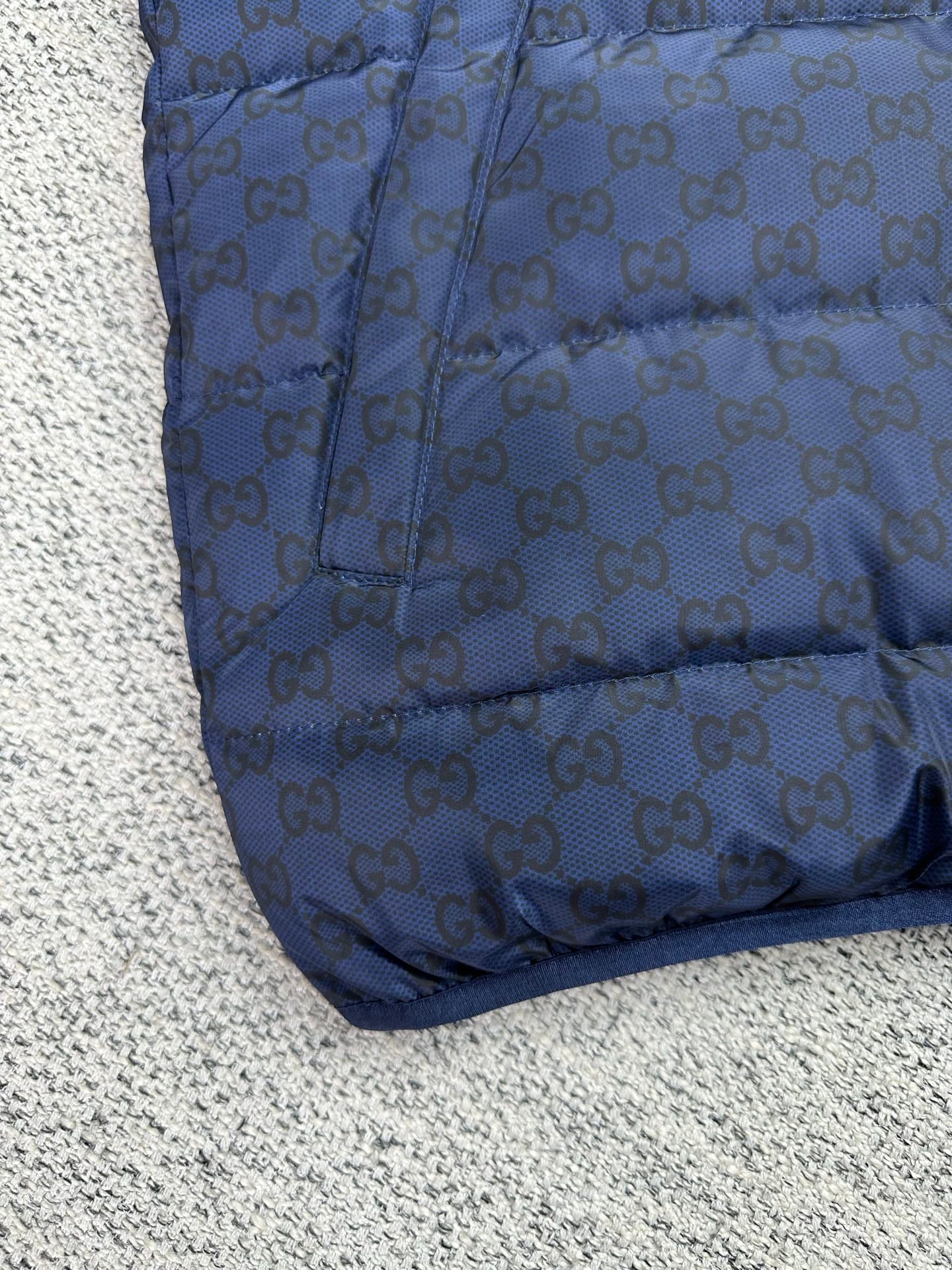 Gucci blue GG-pattern quilted puffer jacket, curved hem and panel stitching