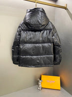 Moncler long padded jacket back view with hood and dark quilted paneling