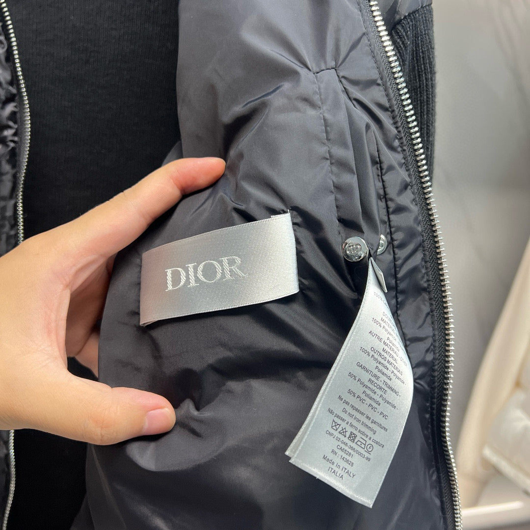 Long quilted jacket fabric close-up with Dior size/brand label and care tag