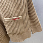 Beige ribbed knit cardigan cuff with logo patch on hem