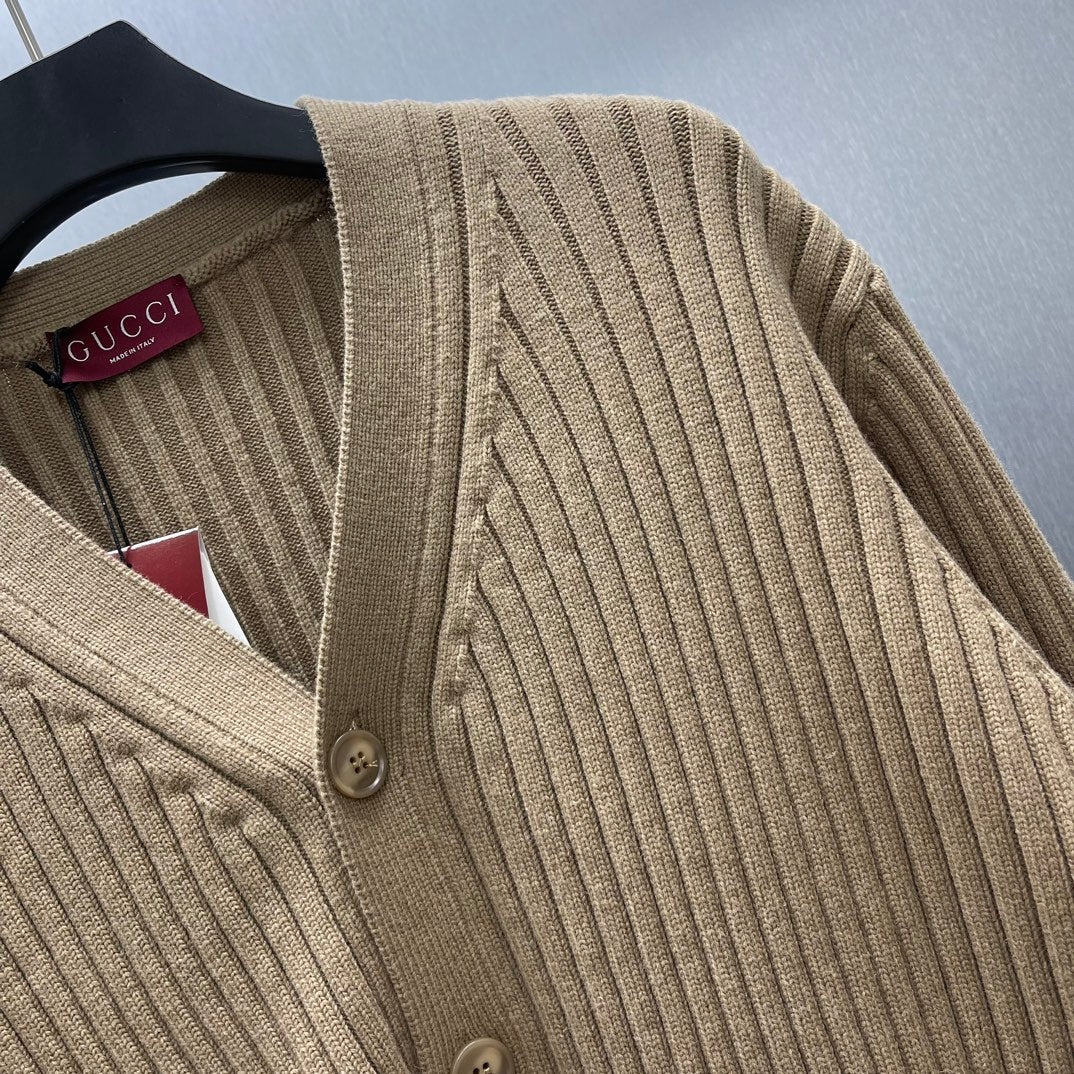 Beige ribbed knit cardigan with button detail at neckline
