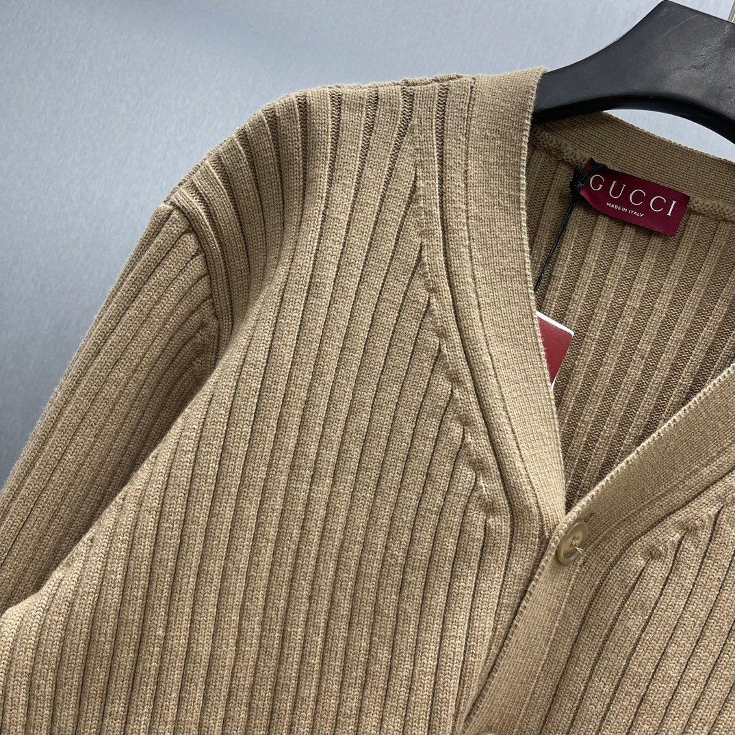 Beige ribbed knit cardigan shoulder and V-neck button placket