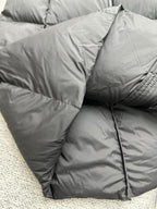 Moncler long puffer coat with padded shoulders and hooded collar seam