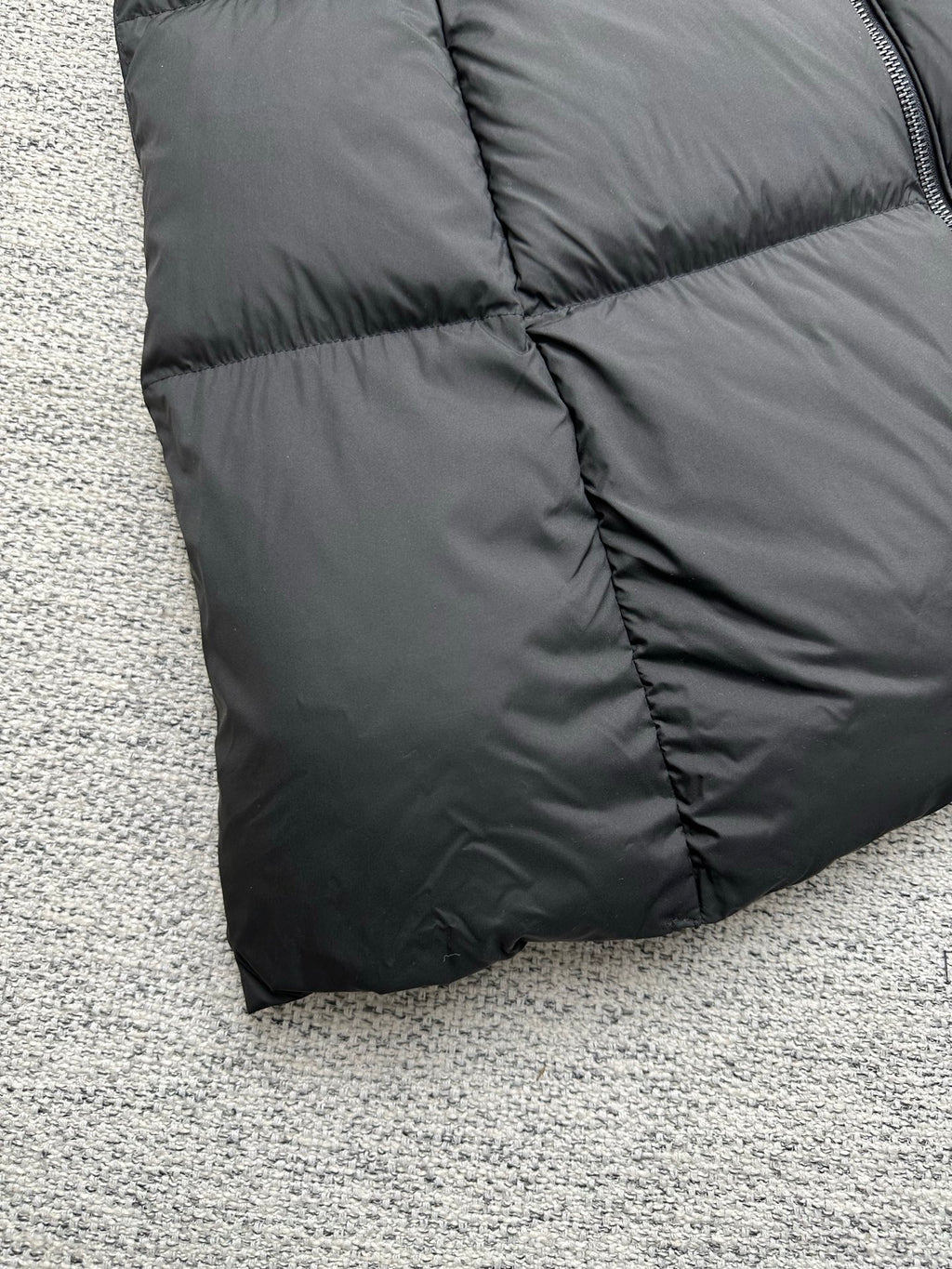 Moncler long puffer coat lower hem with quilted diamond stitching