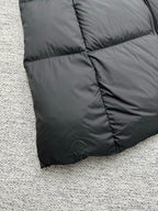 Moncler long puffer coat lower hem with quilted diamond stitching