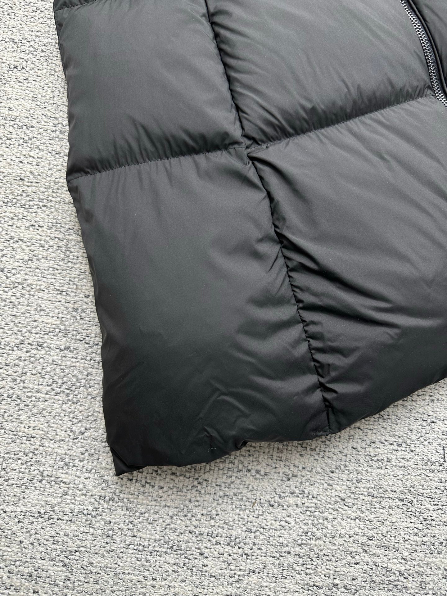 Moncler long puffer coat lower hem with quilted diamond stitching