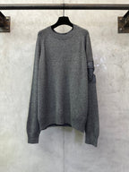 Gray long-sleeve knit sweater with ribbed crew neckline and relaxed fit