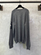Gray long-sleeve knit sweater, back view, crew neckline and ribbed cuffs