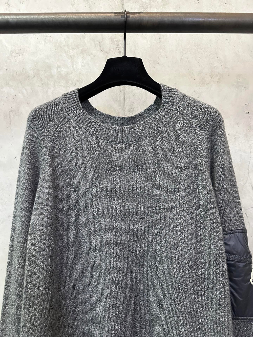 Gray heather knit sweater with ribbed crew neckline and long sleeves