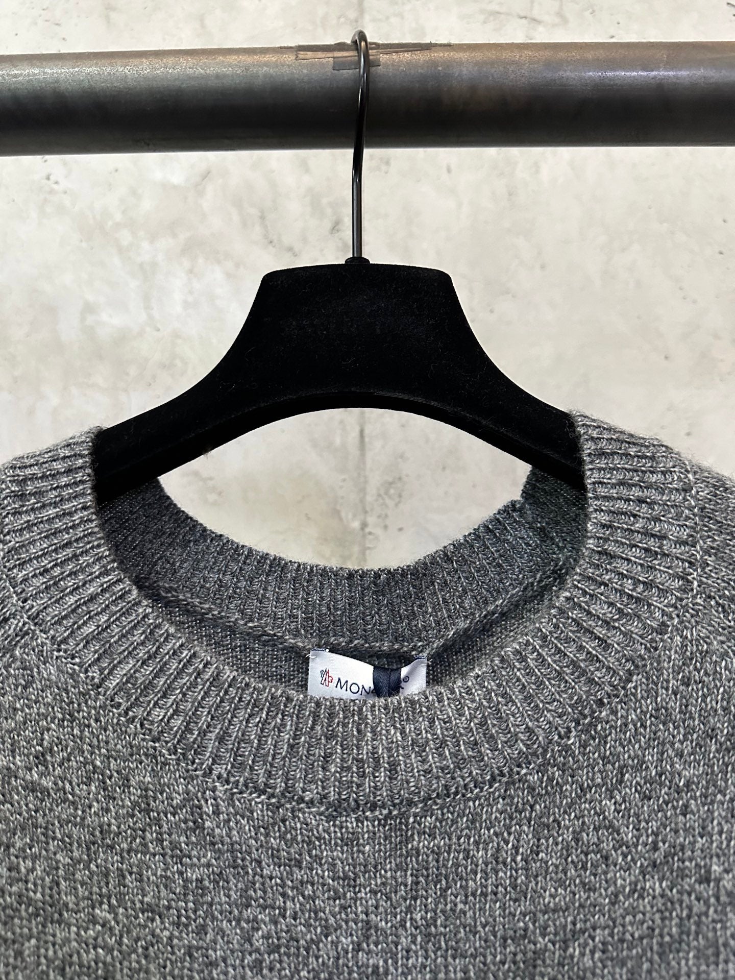 Gray heather knit crew neckline with small interior neck label