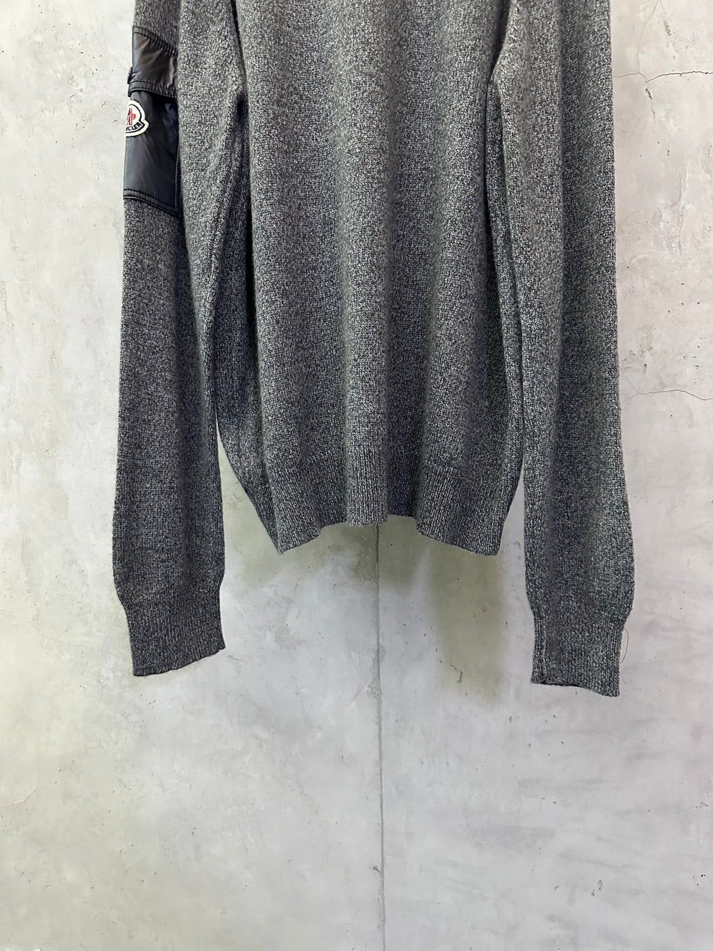 Gray heather knit sweater back view with ribbed cuffs and hem