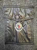 Gray sweater with navy pocket panel and embroidered logo patch