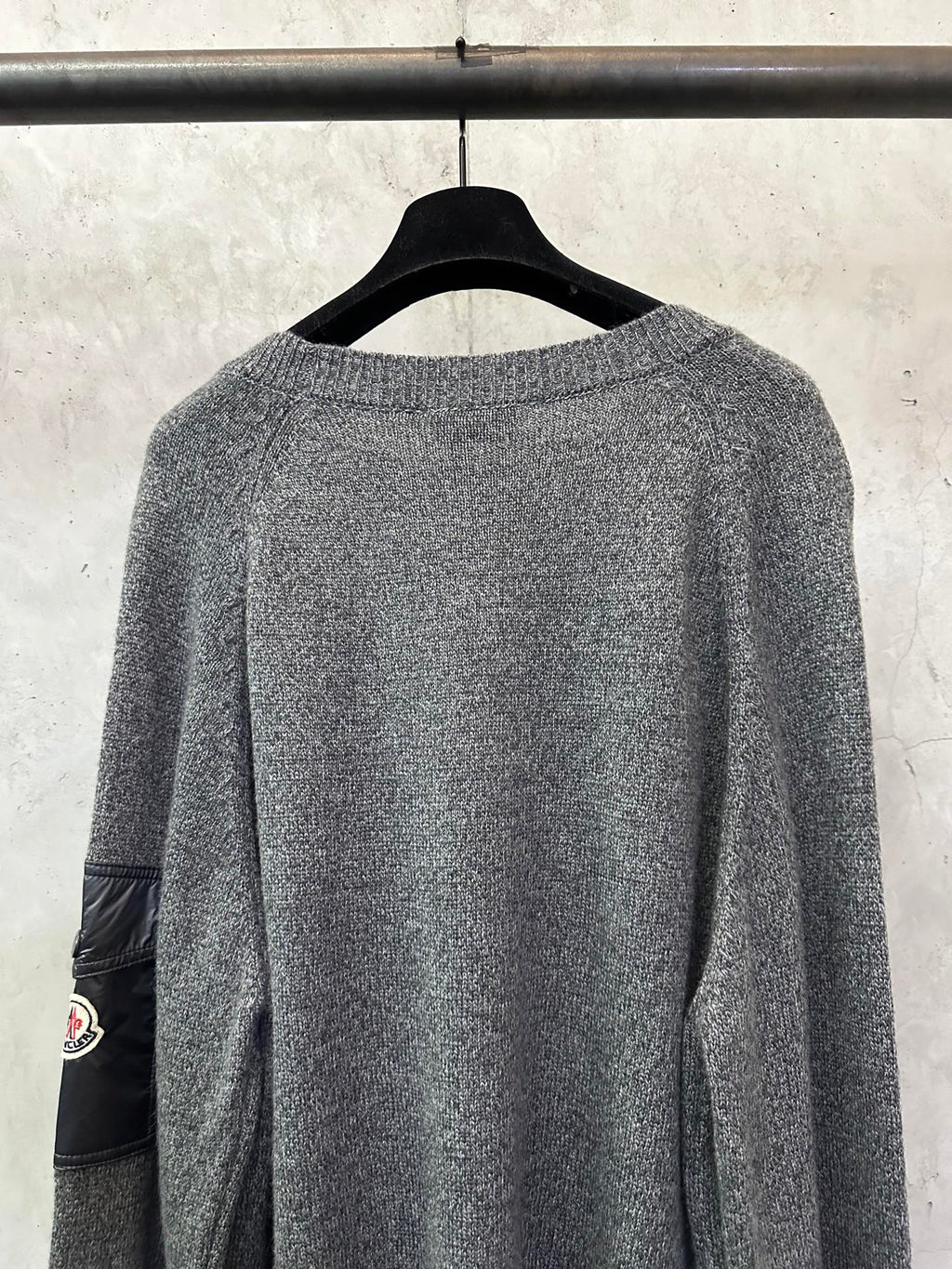 Gray heather knit sweater, side view, ribbed collar and long sleeves