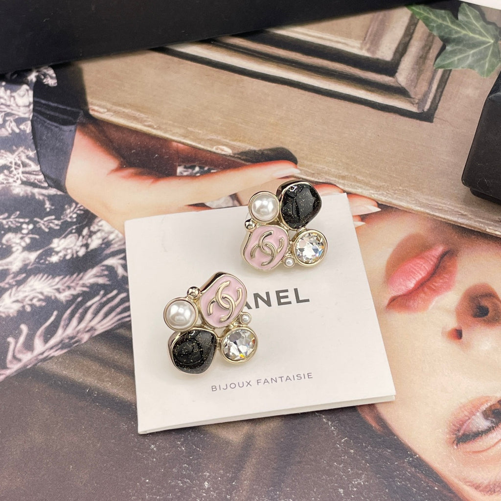 Chanel-style charm earrings on white card, gold-tone charms with pearls and rhinestones
