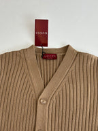 Tan ribbed knit V-neck cardigan with button placket and Gucci logo tag