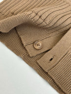 Tan knit cardigan pocket and round button detail on ribbed fabric