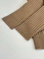 Tan ribbed knit cardigan sleeve cuff and straight hem