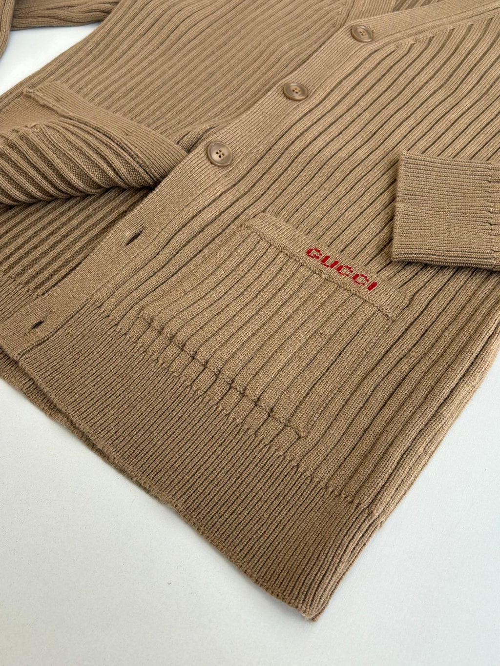 Tan ribbed knit cardigan with button front and Gucci logo patch