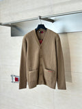 Tan ribbed knit cardigan with button front and patch pocket detail