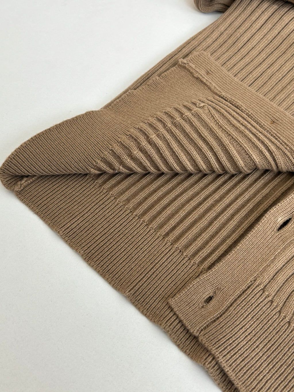 Tan ribbed knit cardigan with folded shoulder and ribbed sleeve cuff detail