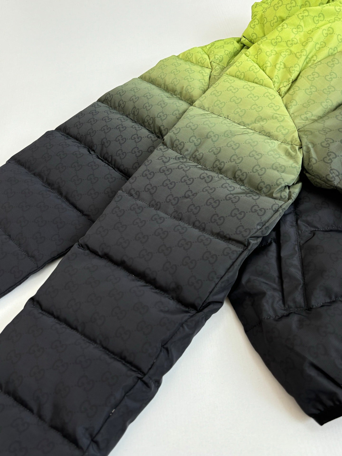 Gucci long puffer jacket with lime green and dark contrast, quilted panels