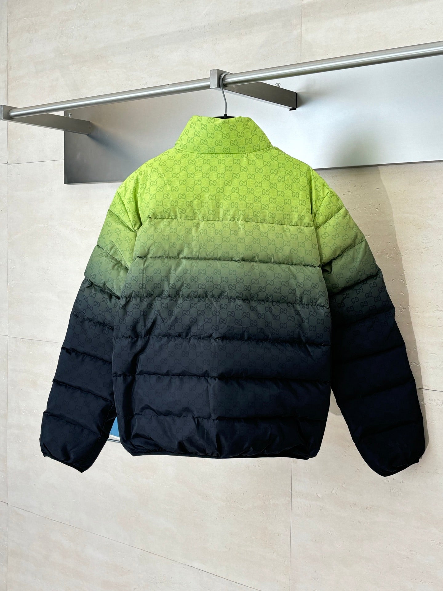 Puffer jacket back view, lime green top and dark bottom, full-zip