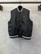 Sleeveless dark jacket with striped ribbed collar and Prada logo patch