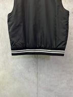 Sleeveless dark bomber vest with striped ribbed hem and smooth fabric