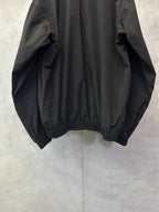 Black long bomber jacket, back view, gathered elastic hem and cuffs