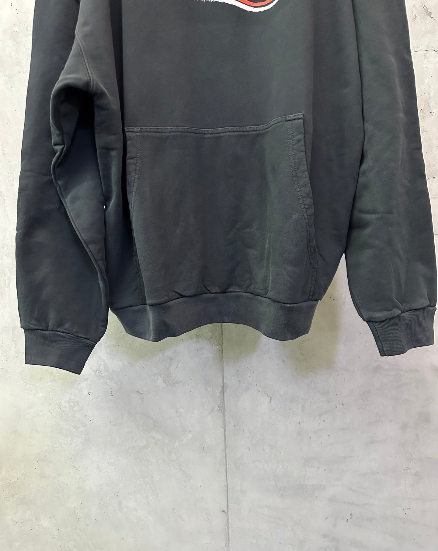 Balenciaga dark hoodie front pocket and hem seam detail, long sleeves