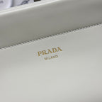Prada logo on white leather handbag front panel with decorative stitching