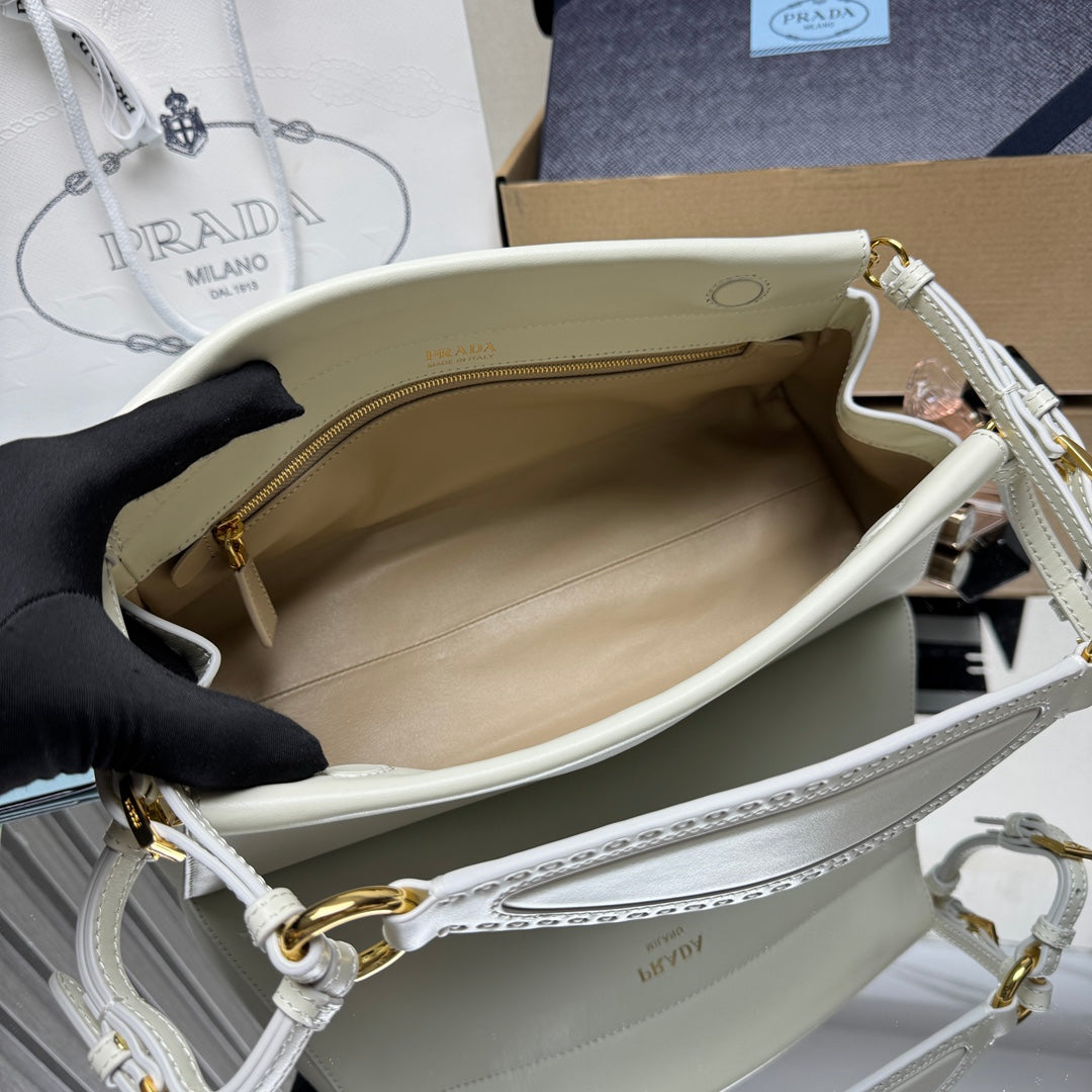 Prada white leather handbag interior with gold zipper and side opening
