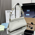 Prada white leather handbag angled view with top handle and gold-tone rings