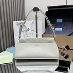 Prada white leather handbag with top handle, gold hardware, and front logo plaque