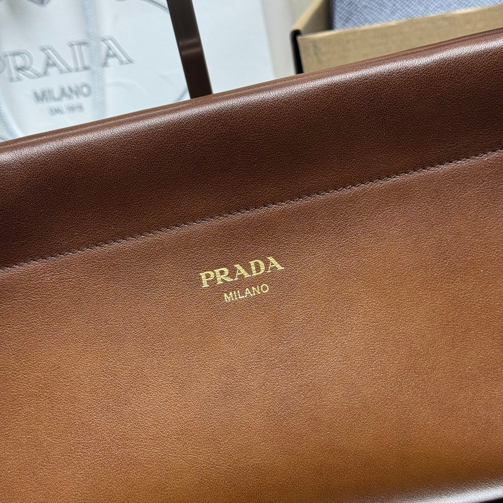 Prada brown leather front panel with gold Prada logo and stitched edge