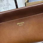 Prada brown leather front panel with gold Prada logo and stitched edge