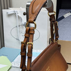 Prada brown leather top-handle bag with gold-tone buckles and chain hardware