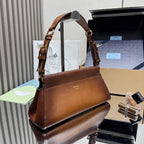 Prada brown leather top-handle handbag with gold hardware and front logo