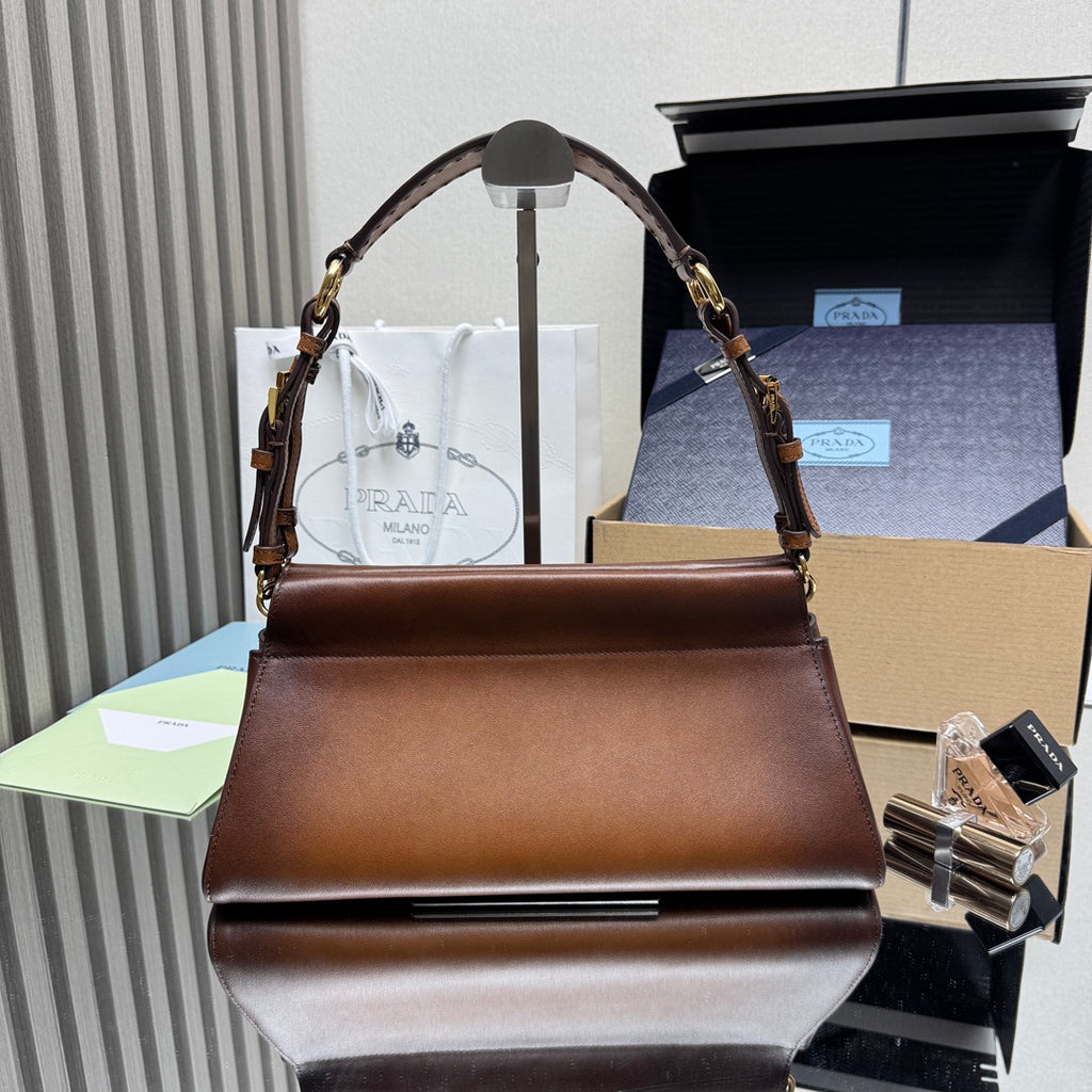 Prada brown leather top-handle handbag with gold chain straps and flap closure