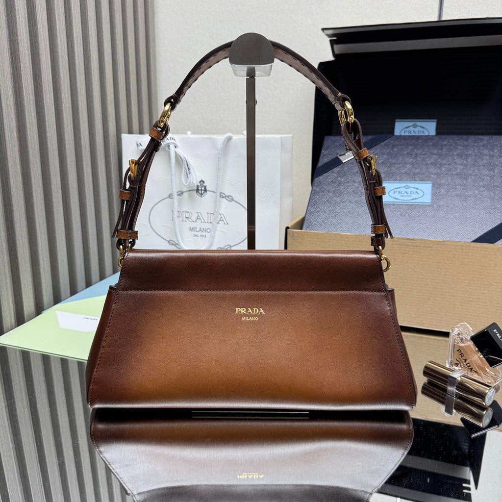 Prada brown leather top-handle handbag with gold hardware and front flap logo