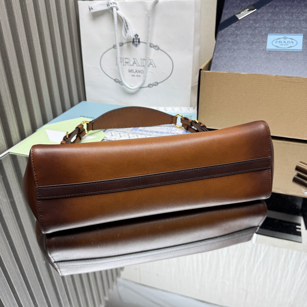 Prada brown leather flap handbag with top handle and contrast lining