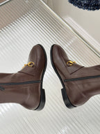 Gucci ladies knee-high leather boots, dark brown, showing slip-on profile and stitch seams