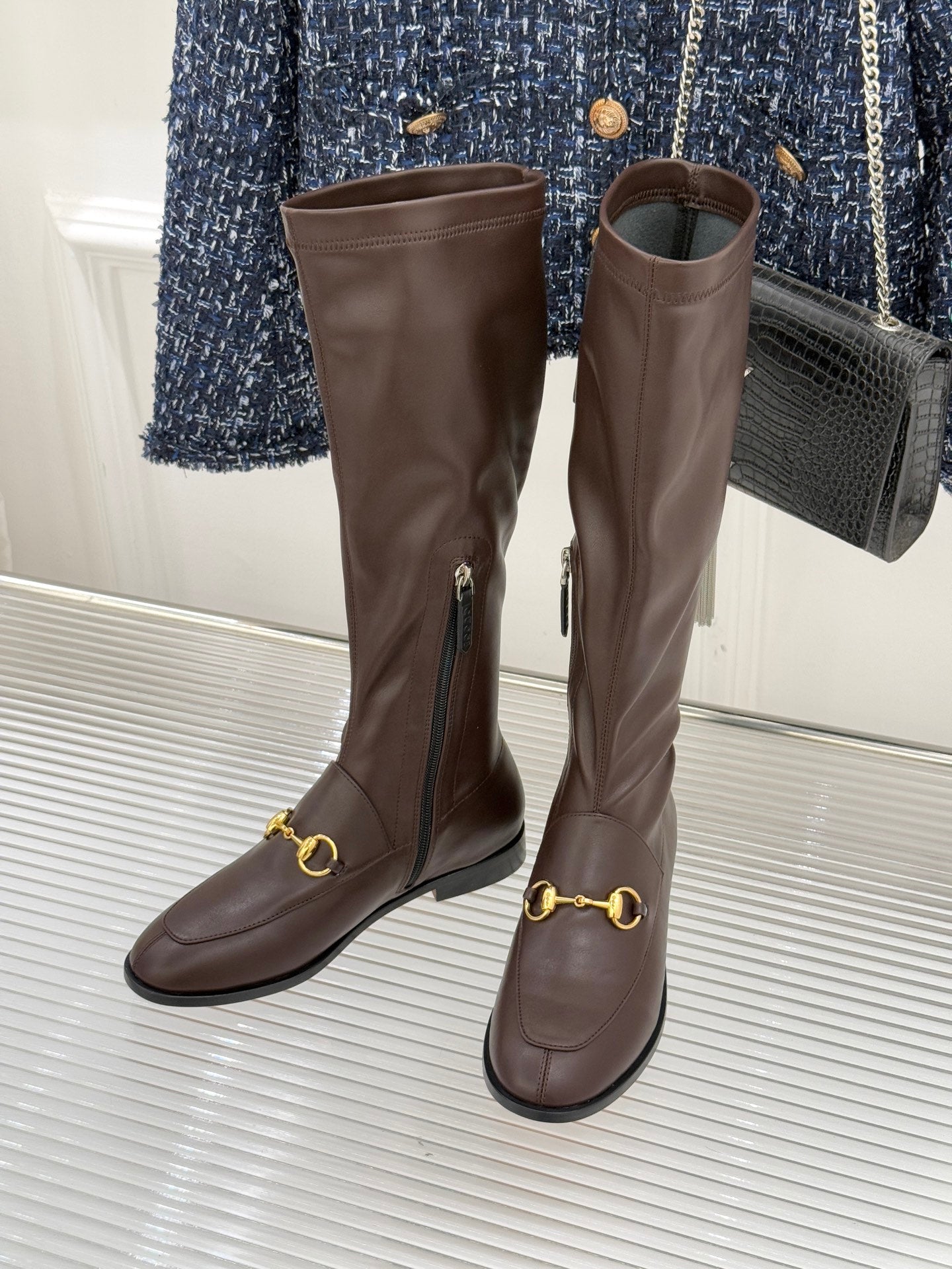 Pair of Gucci ladies knee-high leather boots, dark brown, gold buckle and zip accents