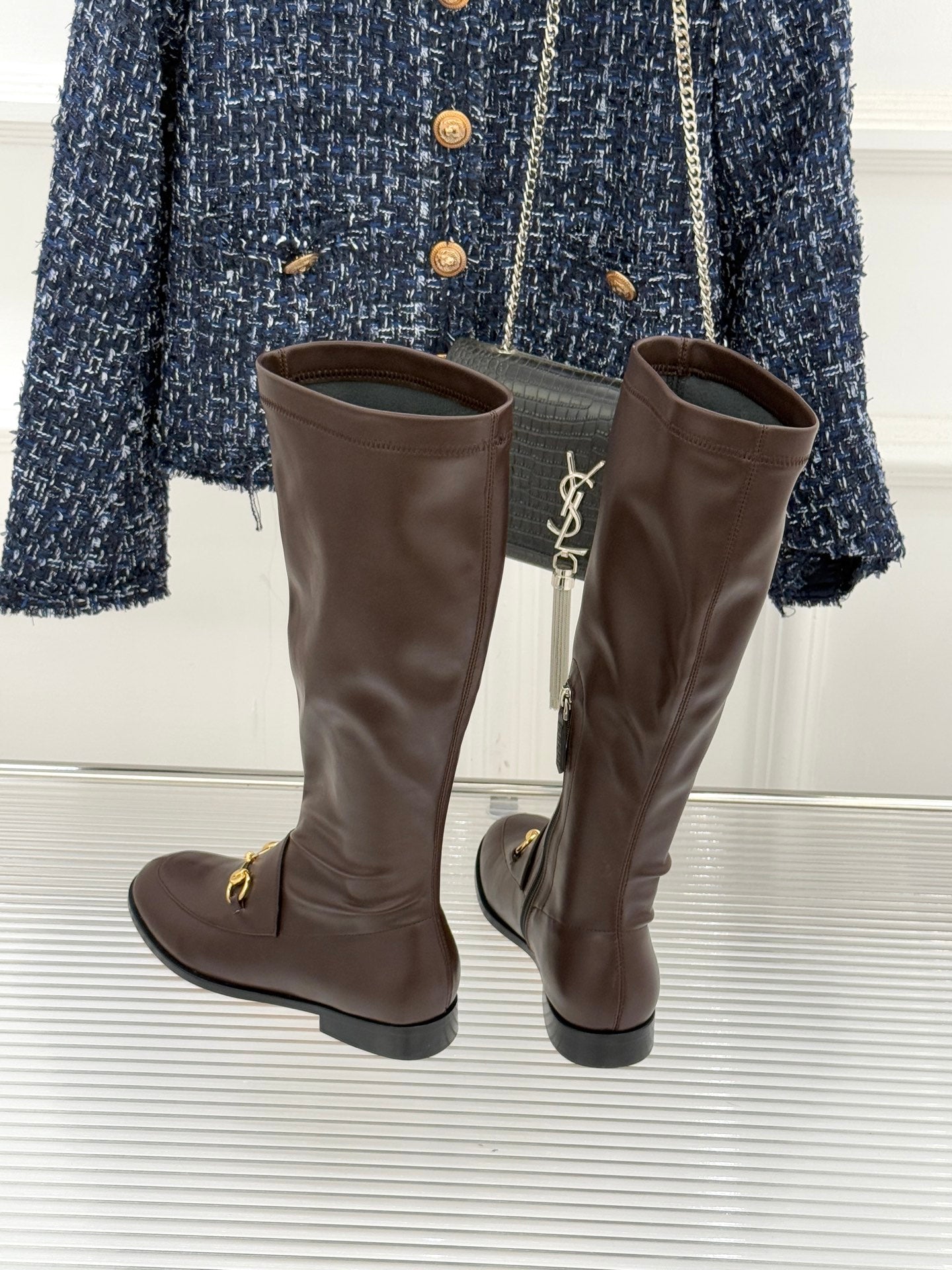 Gucci ladies knee-high leather boots, dark brown, back view with gold trim hardware