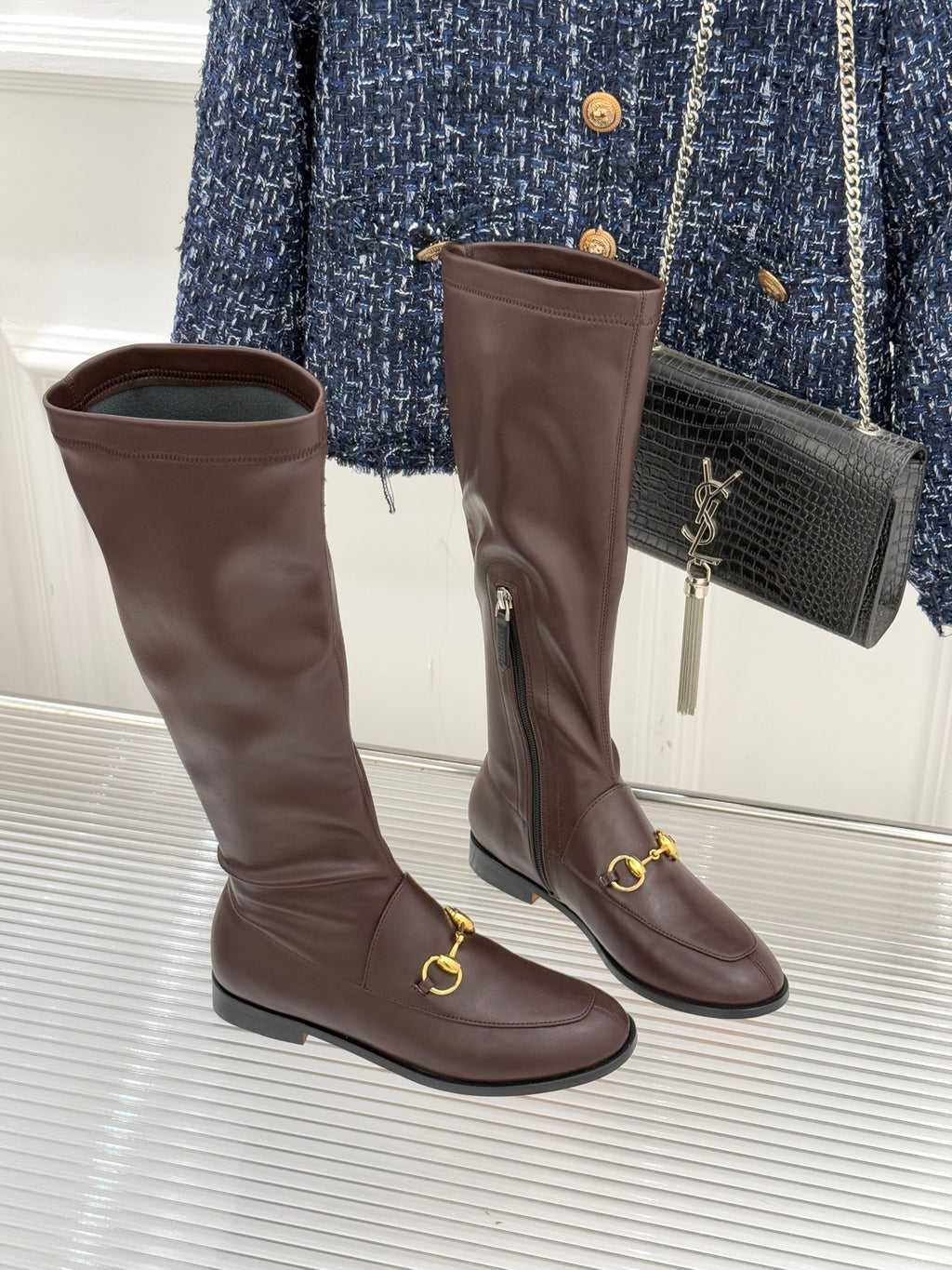 Gucci ladies knee-high leather boots, dark brown, front view with gold-tone hardware