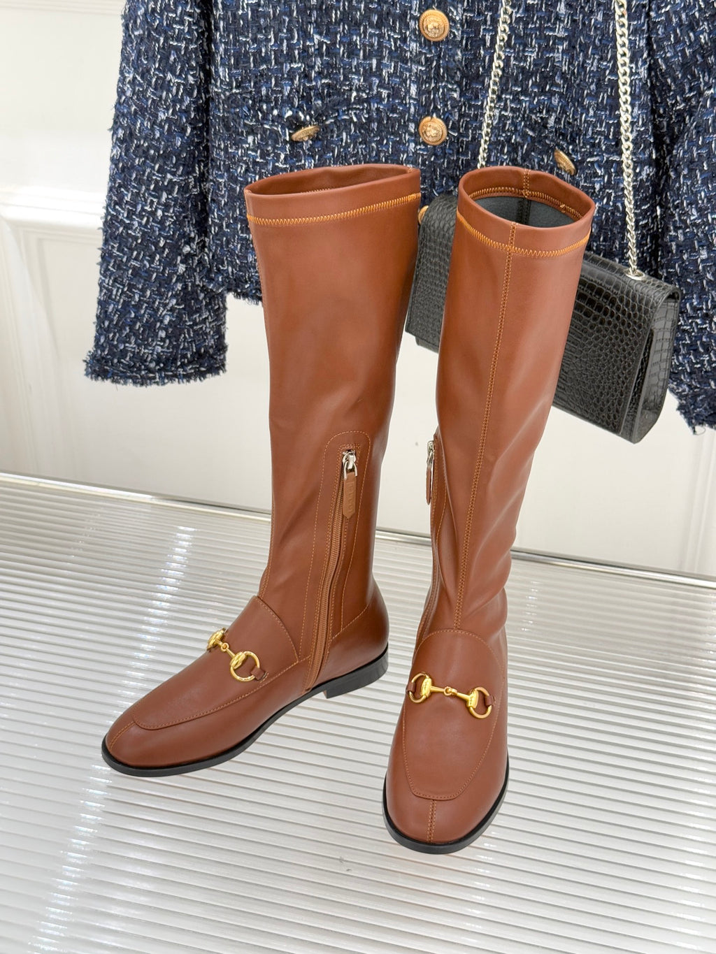 Gucci ladies knee-high leather boots in tan/brown with gold-tone chain buckle accents