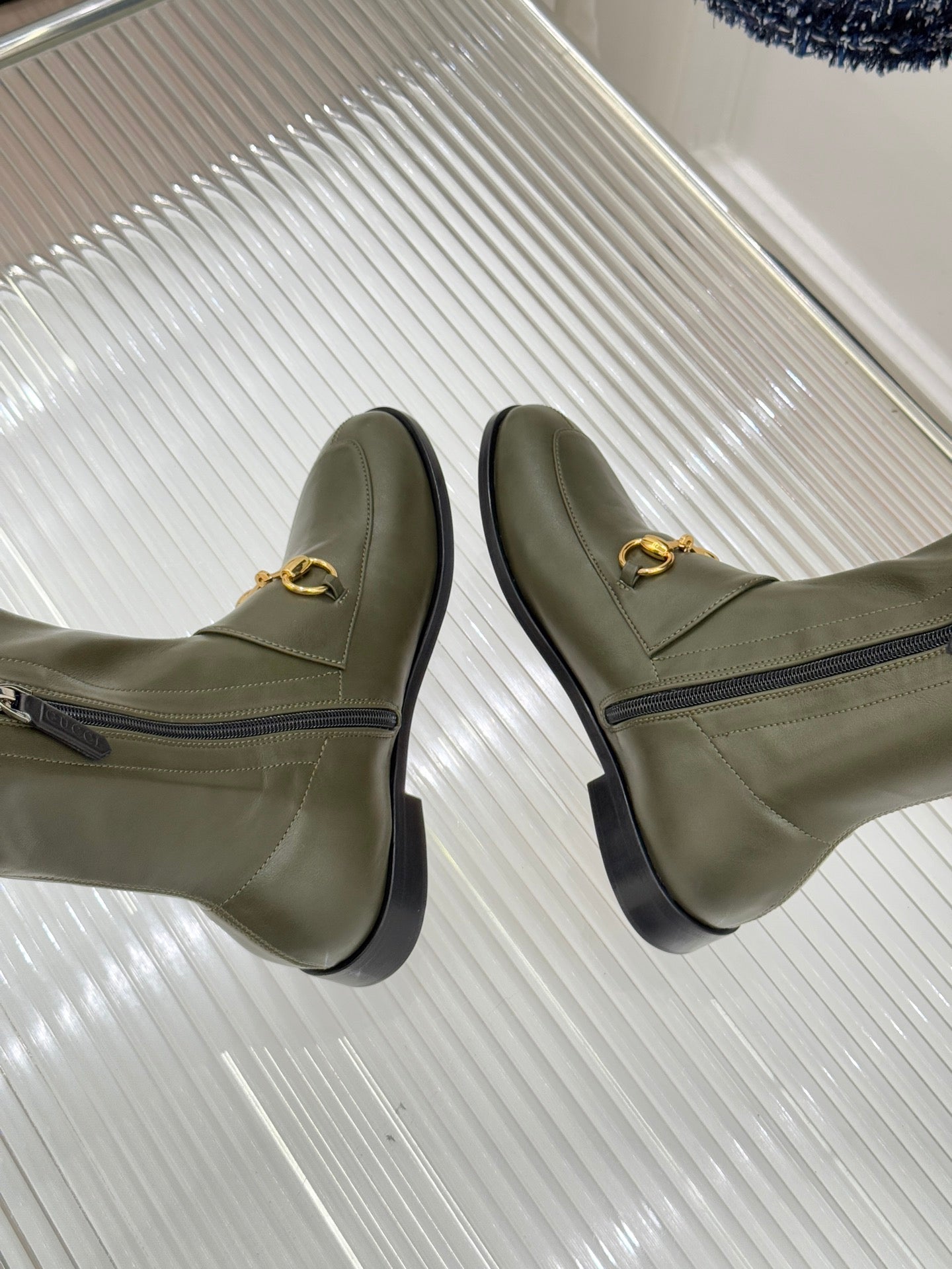 Gucci ladies olive leather ankle boots with gold horsebit detail and side zip