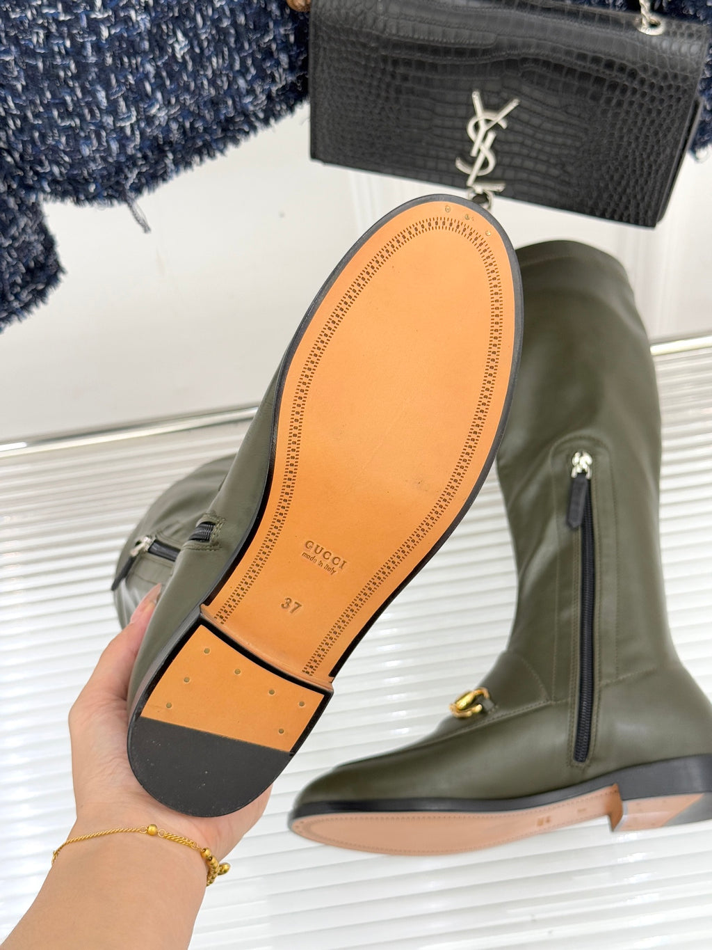 Gucci ladies olive leather boots with tan outsole showing side zip detail